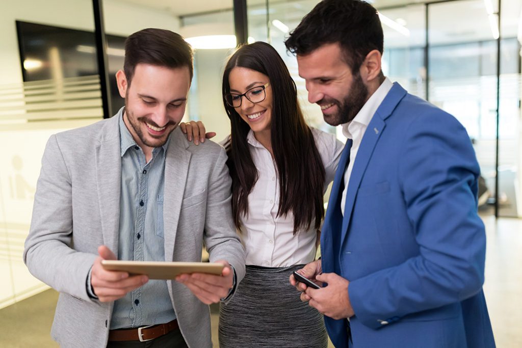 IT professionals working on a tablet